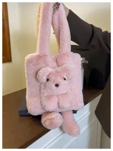 Pink fluffy plush tote bag detail featuring cute 3D cartoon animal design soft texture.