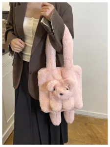 Pink plush dog tote bag for women, cute fluffy shoulder bag, soft cartoon animal handbag.