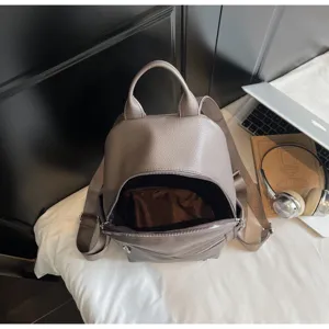 Detail view of the stylish women pu leather casual backpack in grey brown color for daily commute.