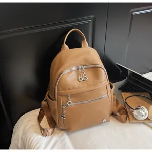 Stylish brown PU leather women backpack with multiple compartments and sleek metal ring zippers.