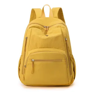 Sac à dos en nylon jaune vif pour étudiants, cartable de loisirs élégant avec poches zippées.