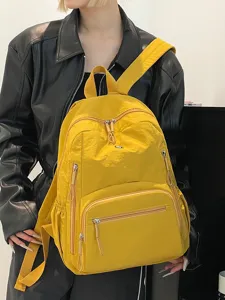 Sac à dos en nylon jaune vif pour étudiants, cartable étanche décontracté avec plusieurs poches.