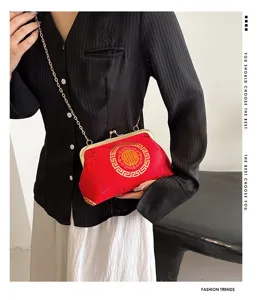 Detailed view of the stylish Chinese style cloud pattern kiss lock shoulder bag.
