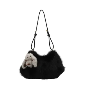 Black plush underarm shoulder bag with rabbit charm, soft faux fur tote handbag for women.