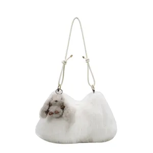 White plush shoulder bag for women, fluffy winter crossbody bag with cute rabbit pendant.