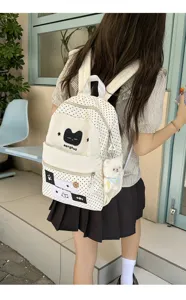 Mochila de lona con lunares japonesa linda con diseño de gato y colgante de felpa para estudiantes.