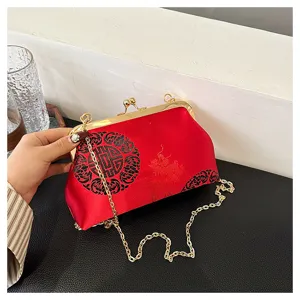 Traditional Chinese style red evening bag with gold chain and exquisite cloud pattern clasp.