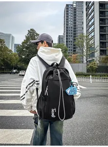 Sac a dos noir tendance avec grande capacite pour voyage, sport et ecole quotidienne.