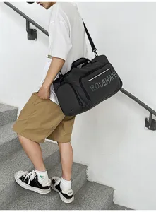 Detail shot of the large capacity travel duffel bag showing textured fabric and sturdy strap.