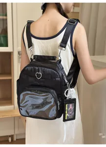 Harajuku style casual black backpack with transparent front pocket and cute heart buckle.