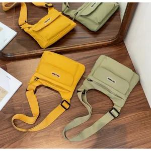 Lässige Umhängetasche mit mehreren Taschen aus Canvas für Damen, ideal für den Alltag.