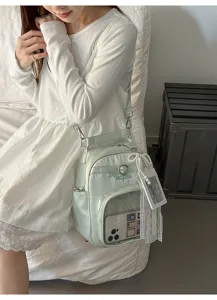 Harajuku style minimalist transparent pocket shoulder bag detail, mint green commuter daypack.