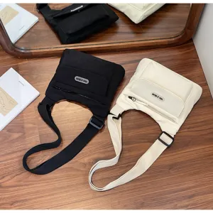 Freizeitmäßige Mehrfleck-Leinwand-Umhängetasche für Frauen, japanischer Stil Pendler-Schultertasche.