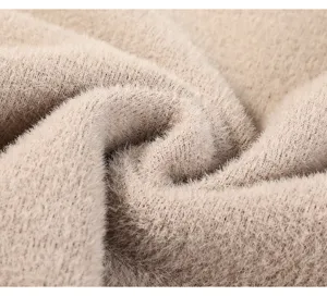 Close-up van dik pluche gebreid stof, zacht textuurdetail voor warme winterkleding
