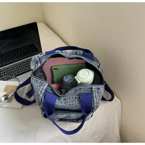 Detailed view of the large capacity washed denim backpack interior storage and daily use items.