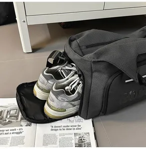 Detail view of the travel duffel bag showing convenient separate shoe compartment storage.