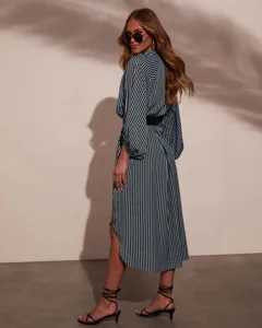 Detailed view of women's long sleeve striped shirt dress with a sleek black belt for autumn.