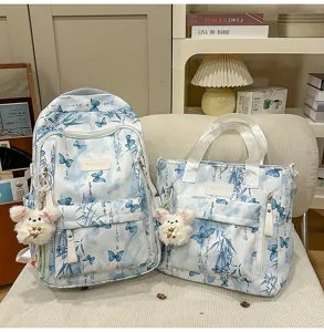 Blaues und weißes chinesisches Schmetterlings-Schülerrucksack- und Tragetaschen-Set.