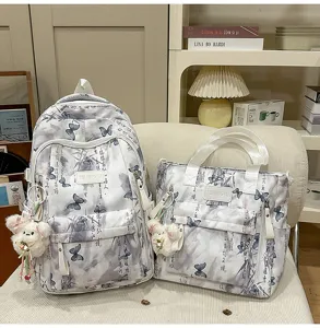 Stilvoller Schuelerrucksack und Handtasche mit chinesischem Schmetterlingsdruck fuer Schule.