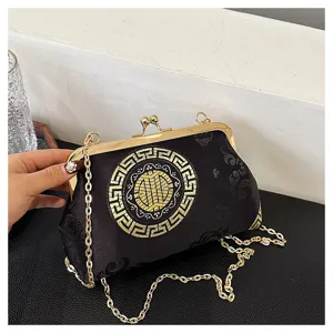 Detailed view of the vintage Chinese style embroidered clutch bag with gold frame and chain strap.