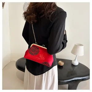 Chic Chinese style cloud pattern kiss-lock evening clutch bag with chain strap for women.