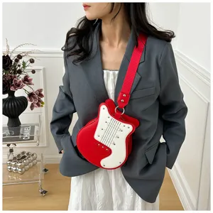 Detailed view of the stylish guitar-shaped colorblock crossbody bag with cool metal rivets.