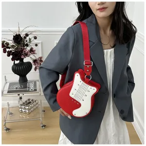 Detailed shot of a creative guitar-shaped shoulder bag in red and white with rivets.