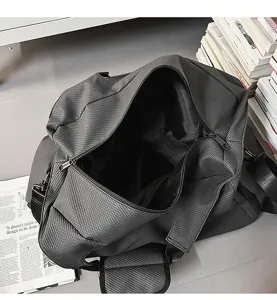 Detail view of the large capacity dark gray checkered travel duffel bag interior and zipper.