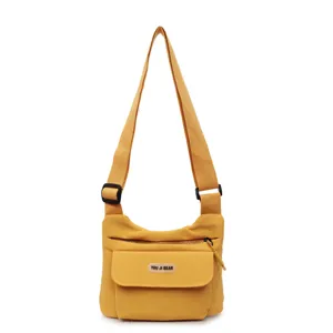 Gelbe lässige Umhängetasche aus Segeltuch mit mehreren Taschen und verstellbarem Gurt für Alltag.