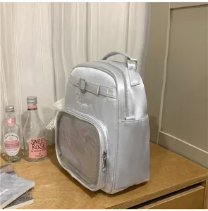 Silver satin ita backpack with clear front pocket and heart buckle detail detail view