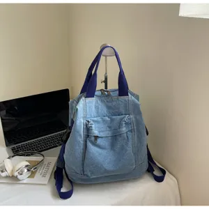 Washed denim women backpack with large capacity and simple ins style for daily student use.
