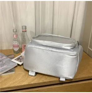 Minimalist transparent window silver satin backpack, stylish daily commuter school bag for women.