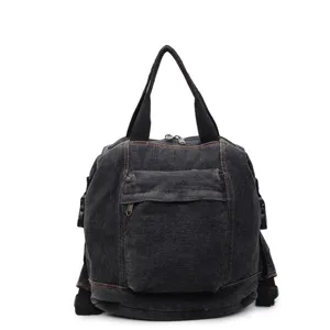 detail view of washed denim women backpack front pocket and dual straps design