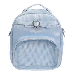 Detailed shot of the light blue crossbody backpack with cute heart metal buckle and mesh pocket.