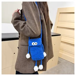 Cute handmade crochet blue monster phone bag, knitted crossbody bag with big eyes for daily use.