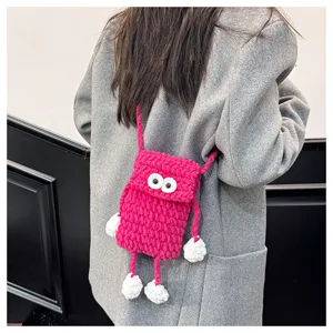 Handcrafted knitted big eye phone bag, cute crochet crossbody shoulder bag for daily commute.
