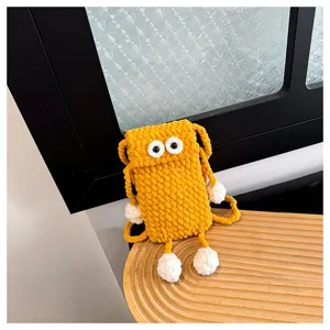 Handmade knitted big eyes phone bag, cute crochet crossbody bag for women commuting daily.