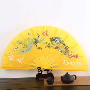 Eventail kung fu en plastique jaune eventail pliant arts martiaux dragon phenix