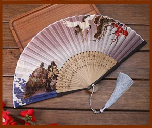 Vintage Chinese style folding fan with exquisite silk cloth, bamboo ribs, and elegant tassel charm.