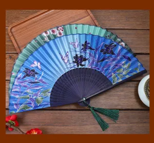 Silk folding fan detail view with exquisite floral and butterfly print, elegant craftsmanship.