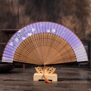 Antique cherry blossom folding fan with wooden stand and purple gradient silk design.
