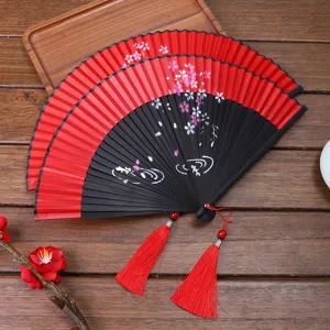 Traditional Chinese Hanfu folding fan with red and black cherry blossom tassel props.