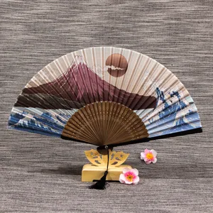 Folding silk fan with wooden stand, Japanese art style mountain and wave design for women.
