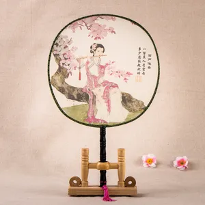 Traditional Chinese silk palace fan classical painting hand fan with wooden stand display.