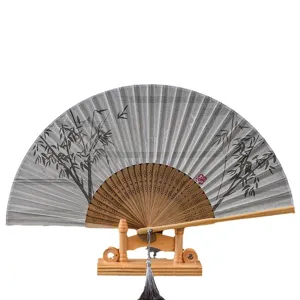 Retro silk folding fan with bamboo art design, wooden display stand and tassel, elegant.