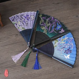 Elegant folding fan with floral tassel, ideal for summer daily use and photography.