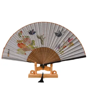 Traditional Chinese folding linen fan with wooden frame and stand, elegant floral butterfly art