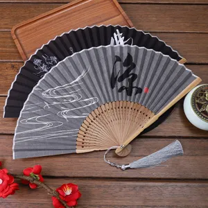Traditional Chinese folding fan with linen fabric, wooden ribs and elegant tassel decoration.