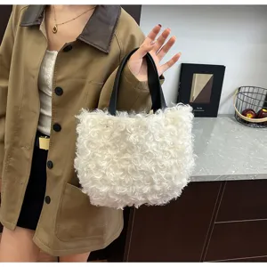 Detail view of the soft white fluffy shearling handbag showing delicate plush texture.