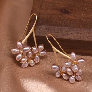 Freshwater pearl flower earrings detail, showing exquisite handmade purple pearl cluster design.